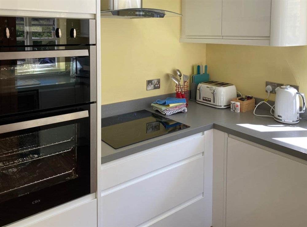 Fitted kitchen with built-in appliances at Manor Cottage in Stiffkey, near Wells-next-the-Sea, Norfolk