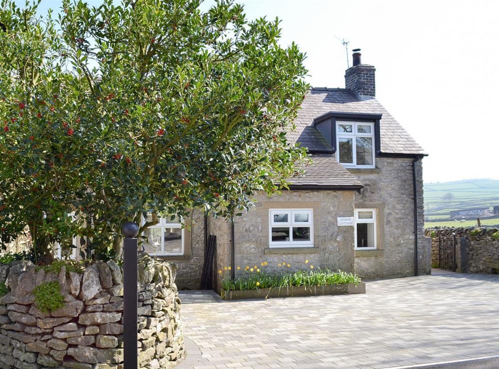 Exterior & parking at Manor Cottage in Wardlow, near Buxton, Derbyshire, England