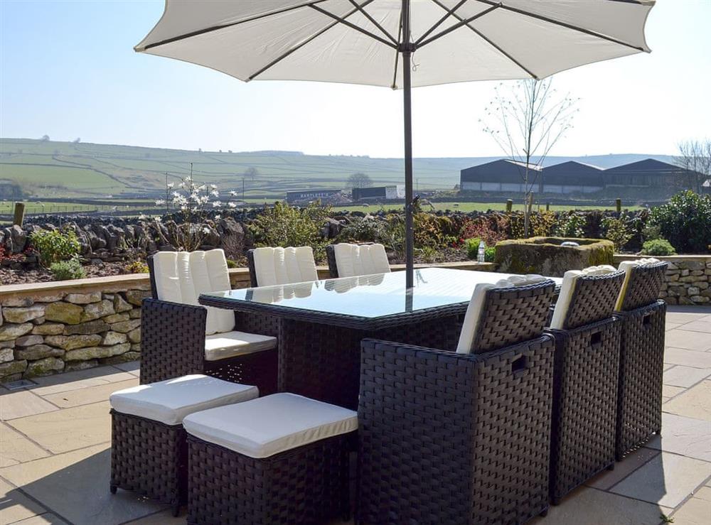 Outdoor dining area at Manor Cottage in Wardlow, near Buxton, Derbyshire, England