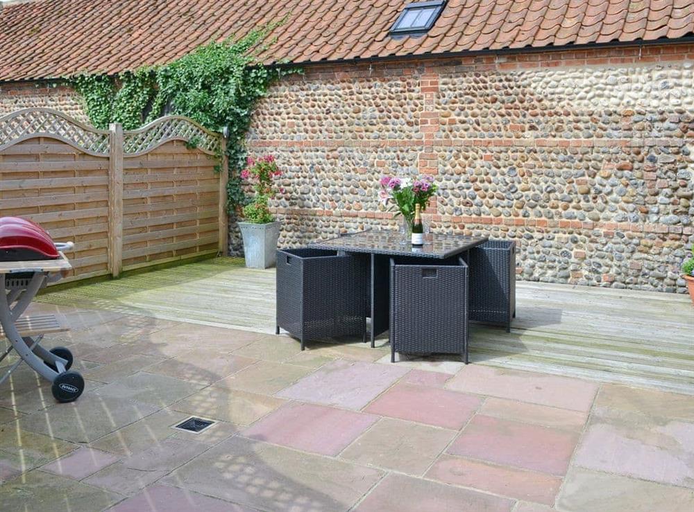 Enclosed courtyard with outdoor furniture and BBQ at Foxs Den, 