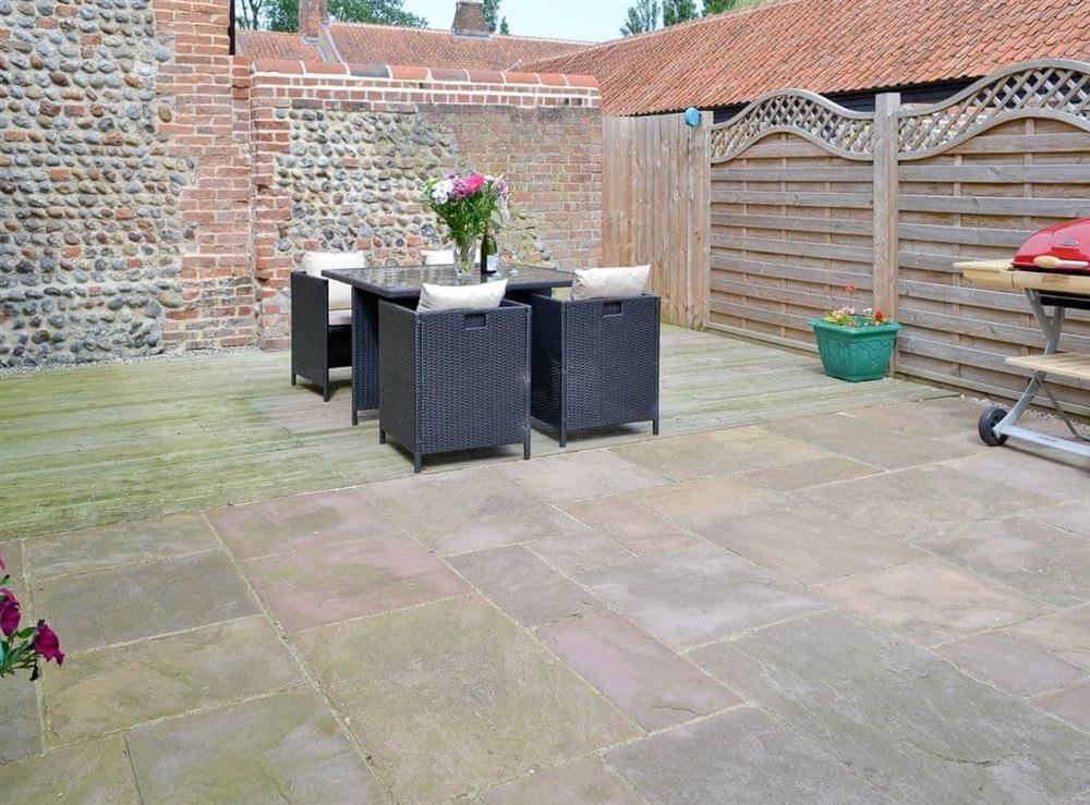 Enclosed courtyard with outdoor furniture and BBQ at Stags Rest, 