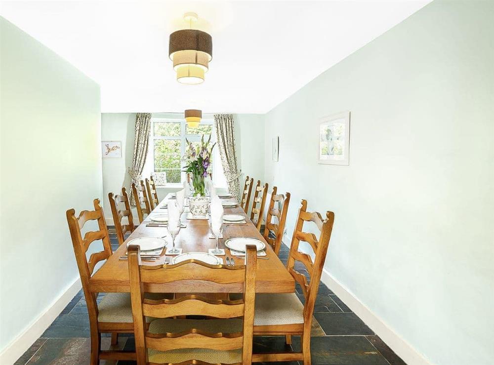 Elegant dining room accommodating up to ten guests at Manor Farm in Daccombe, near Torquay, Devon
