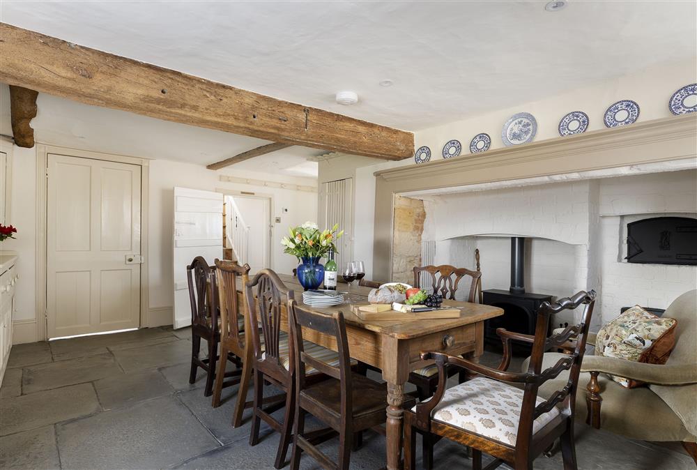 Dining room with seating for ten guests and wood burning stove (photo 2) at Manor Farm, Grafton, Nr Beckford