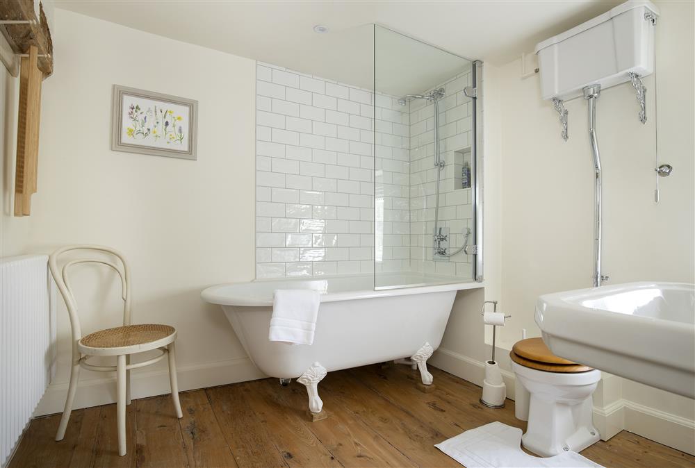 Family bathroom with roll top bath and shower over at Manor Farm, Grafton, Nr Beckford