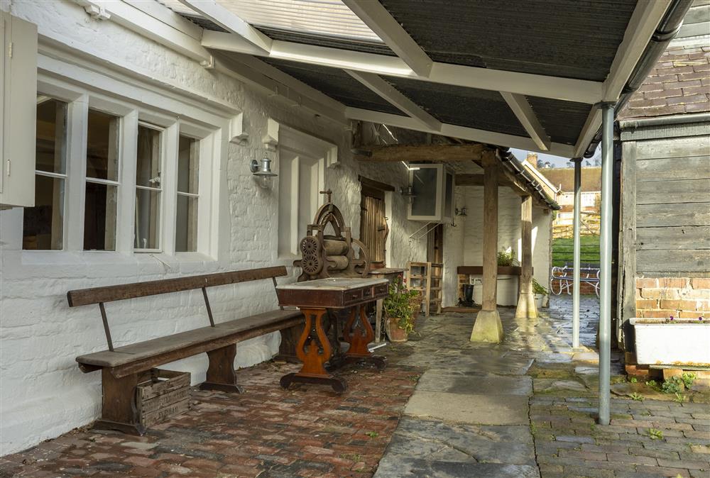 On the east side of the house there is a veranda running the length of the house