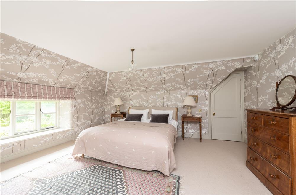 Master bedroom with en-suite bathroom at Manor Farmhouse, Dorchester