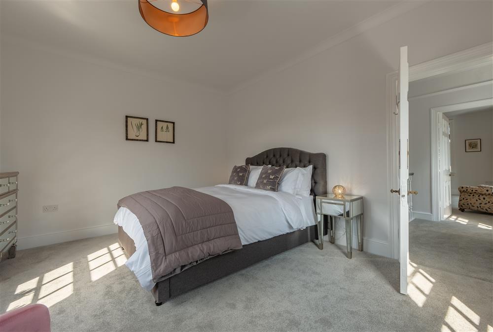 First floor: Bedroom three with a king-size bed at Manor House, Beeford