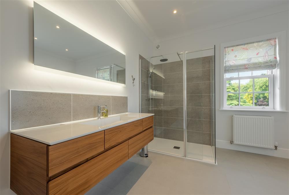 First floor: En-suite with walk-in shower and free-standing bath at Manor House, Beeford