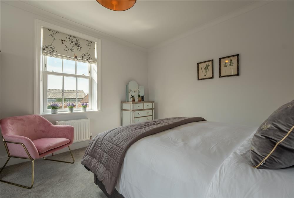 First floor: Tastefully decorated bedroom three with king-size bed at Manor House, Beeford