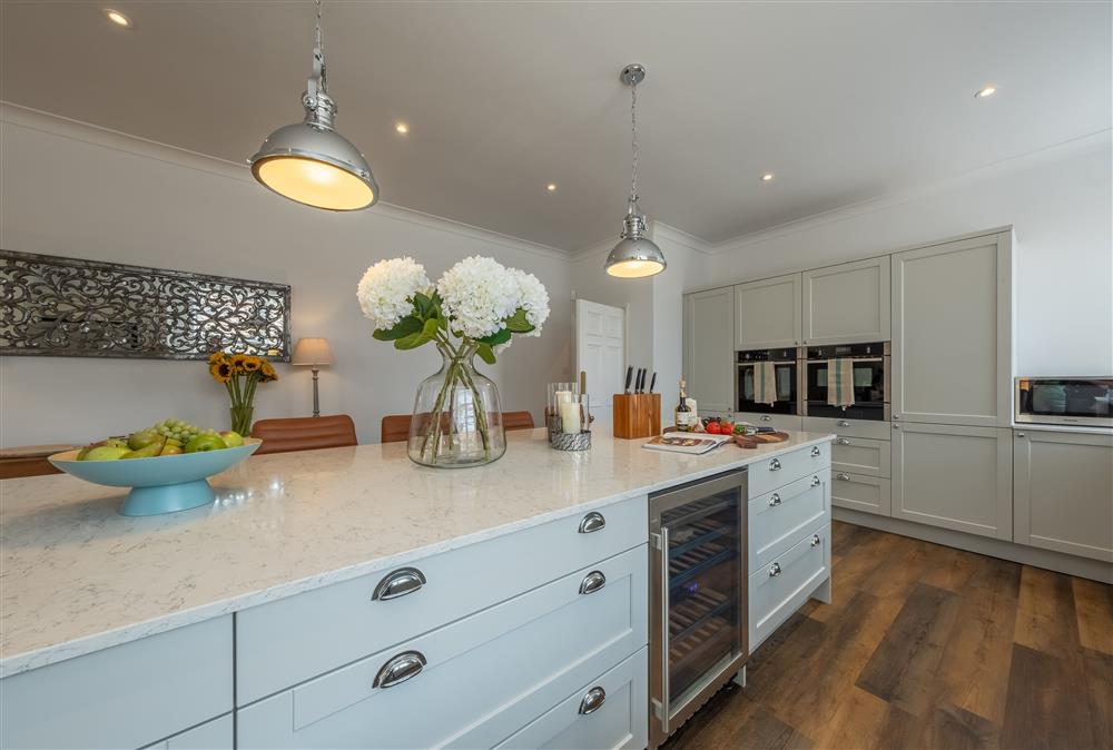 Ground floor: Modern, well-equipped kitchen featuring a double oven and wine cooler at Manor House, Beeford