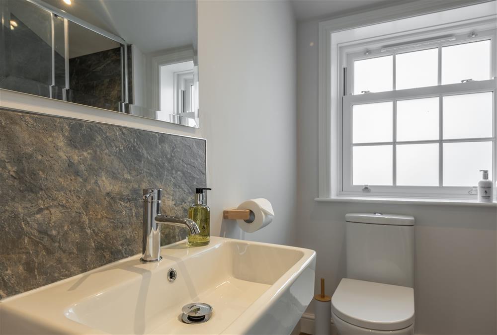 Ground floor: Shower room with wash basin and WC at Manor House, Beeford