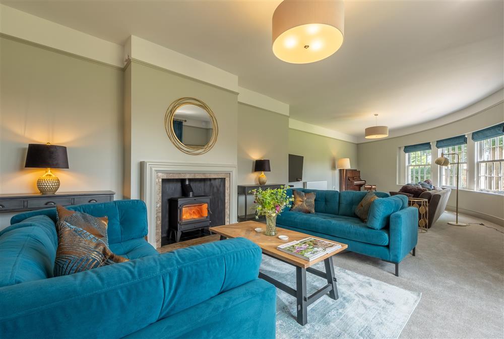 Ground floor: Sitting room, tastefully furnished with a cosy wood burning stove at Manor House, Beeford