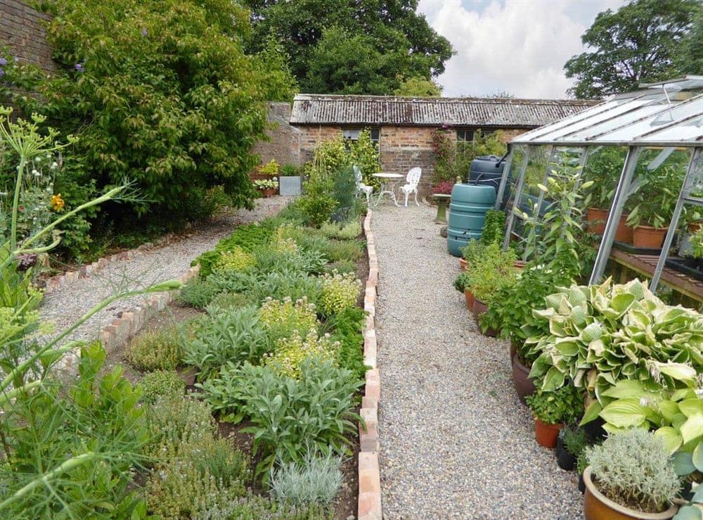 Well-maintained garden areas at Manor House Cottage in Holme on Swale, near Thirsk, North Yorkshire
