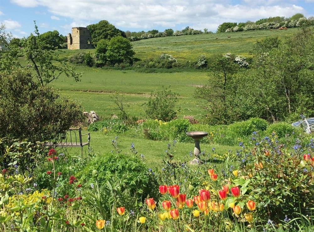 Large, enclosed, riverside garden at Manor House Dairy Cottage in East Ayton, near Scarborough, North Yorkshire