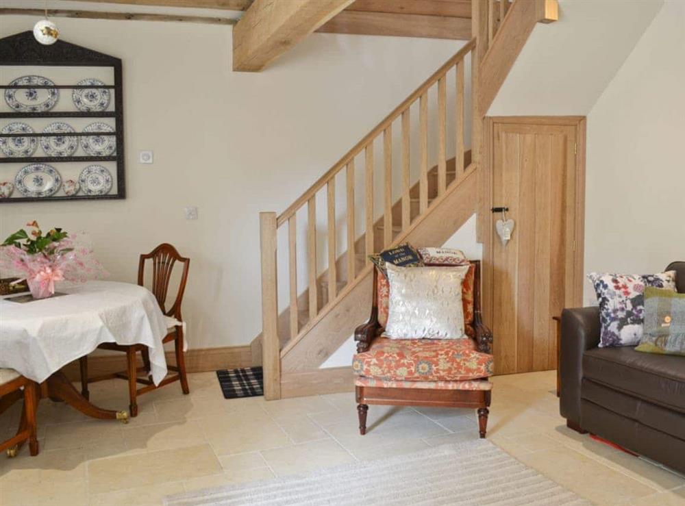 Living room with dining area at Manor House Dairy Cottage in East Ayton, near Scarborough, North Yorkshire