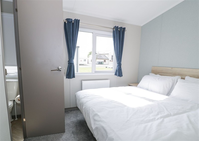 One of the bedrooms at Manor House Gold 2 Bedroom (05F), Maryport near Aspatria
