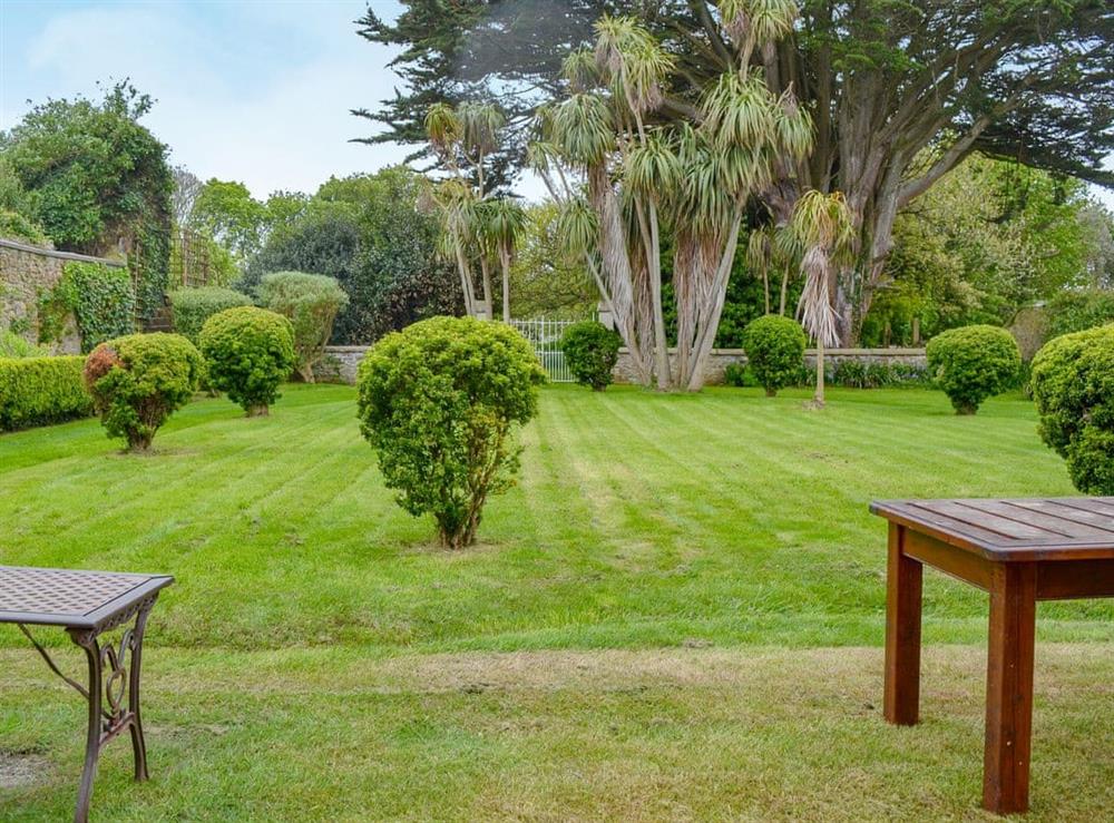 Attractive lawned garden at Manor House in Hayle, Cornwall