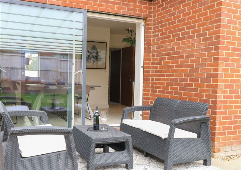 Enjoy a glass of wine on the patio at Manor Park View, Norwich