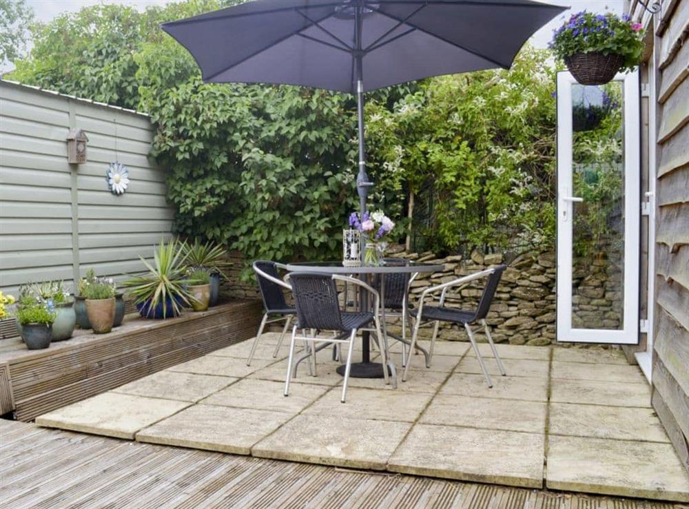 Private and secluded patio area with furniture at Maple Lodge in Corsham, Wiltshire