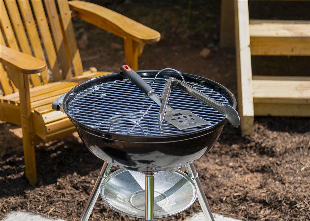 A Weber charcoal barbecue allows for al fresco dining