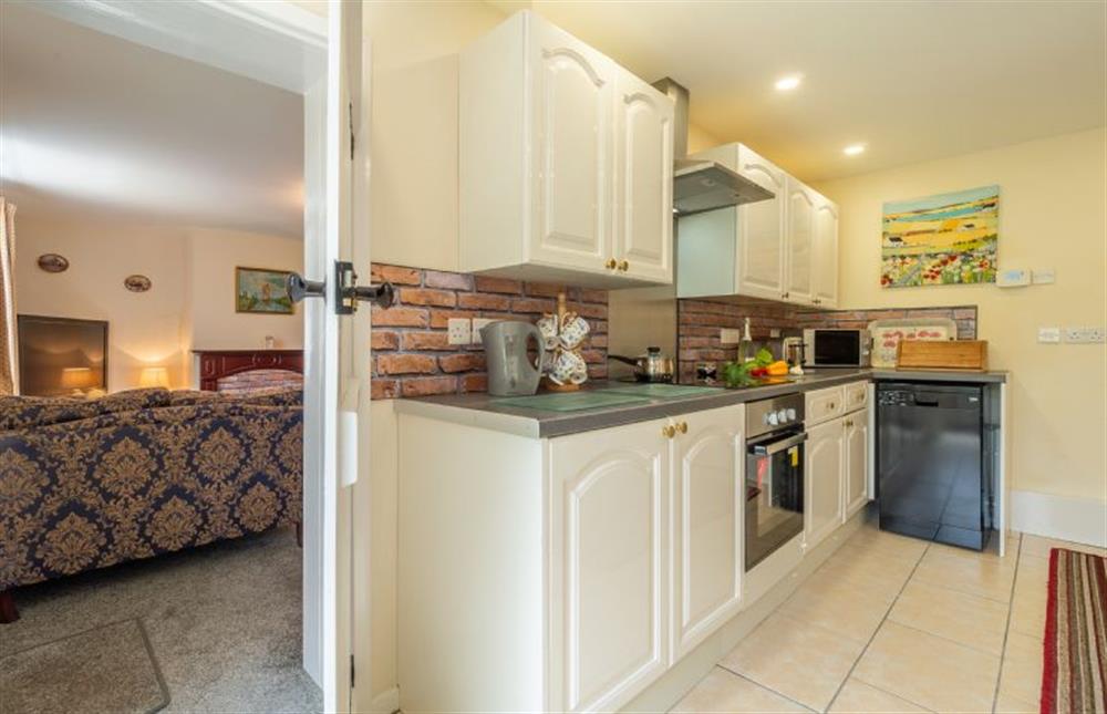 Ground floor: Kitchen with view back to sitting room at Margarets Cottage, Potter Heigham near Great Yarmouth