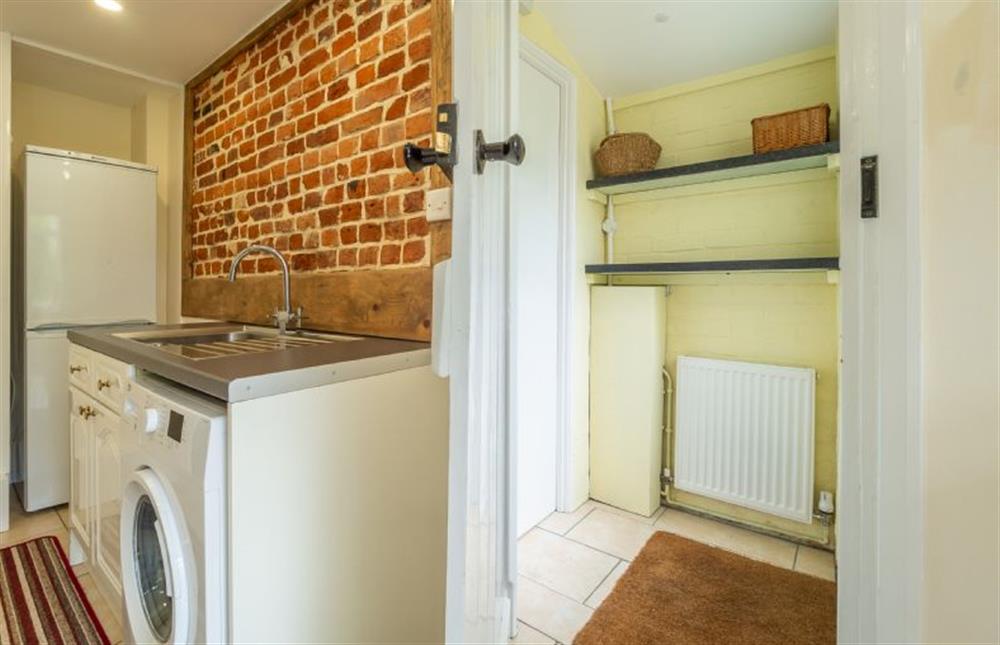 Ground floor: Kitchen with view to lobby and back door at Margarets Cottage, Potter Heigham near Great Yarmouth