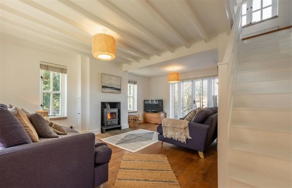 Marigold Cottage  -  Sitting room featuring a wood burning stove and plenty of comfy seating