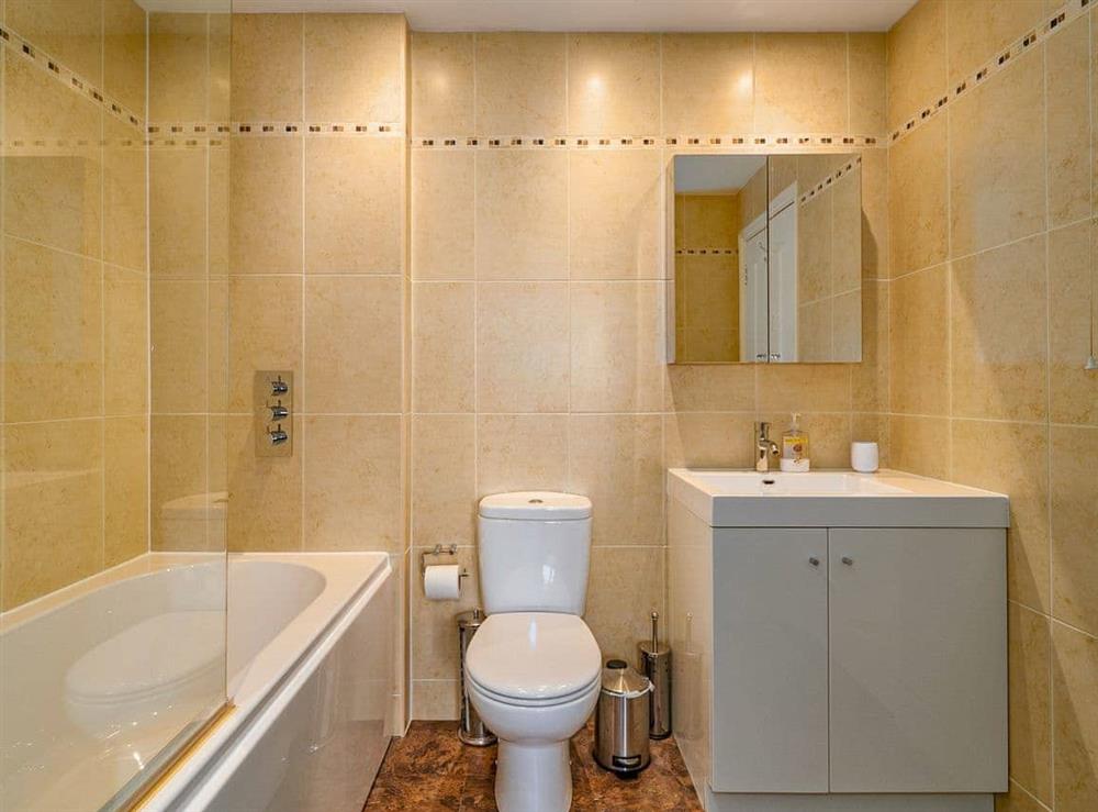 En-suite bathroom with shower over bath at Marina View in Mount Batten, near Plymouth, Devon