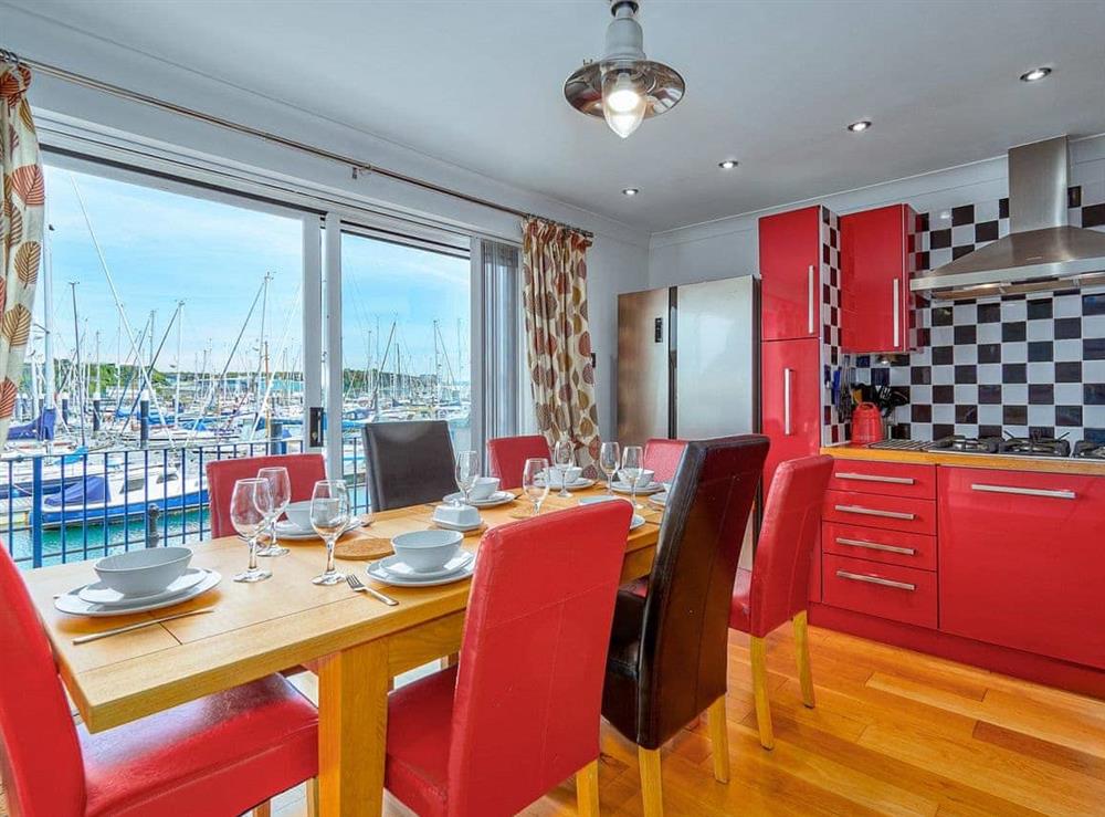 Well-equipped kitchen with dining area at Marina View in Mount Batten, near Plymouth, Devon
