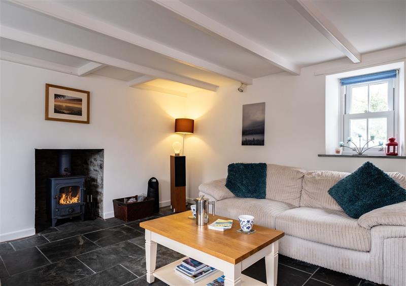 Relax in the living area at Marine Cottage, Penmayne in Rock