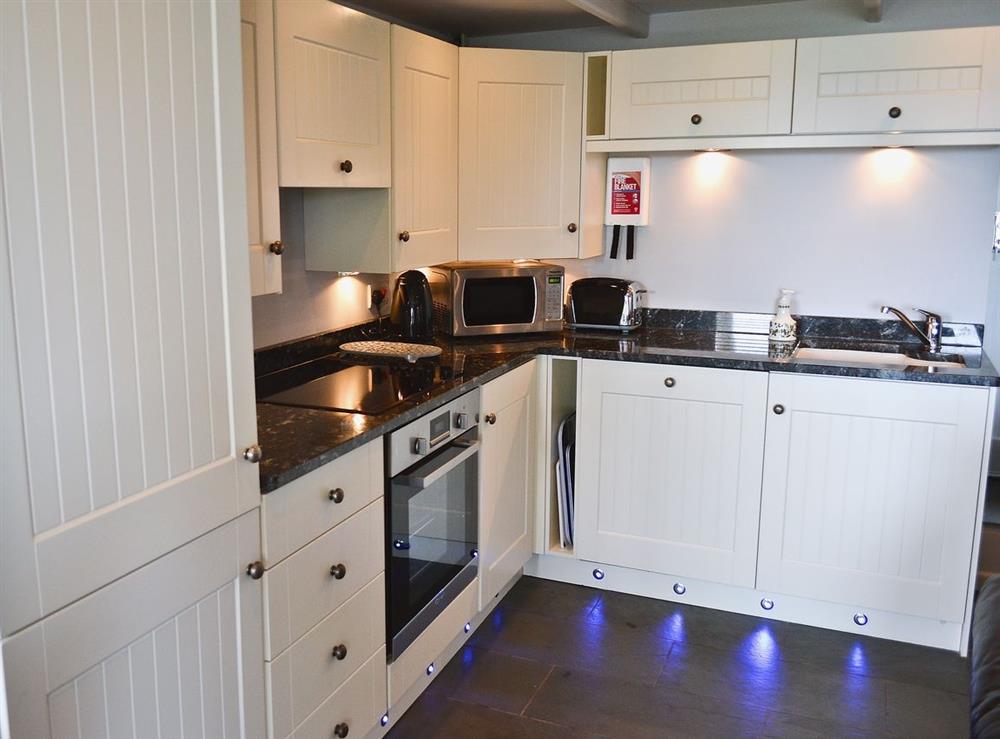 Kitchen/diner at Mariners Cottage in Mousehole, Penzance, Cornwall., Great Britain