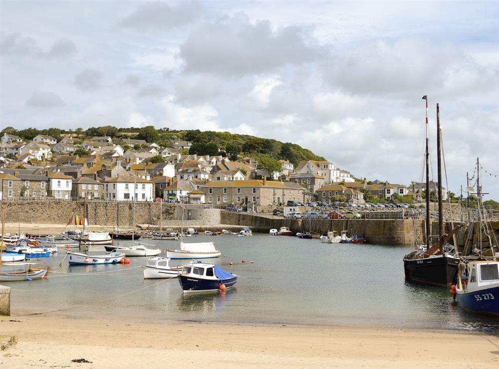 Mousehole harbour at Mariners Cottage in Mousehole, Penzance, Cornwall., Great Britain