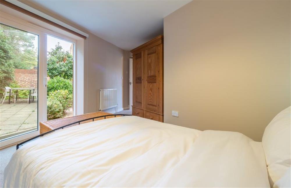 Bedroom with French doors to the garden at Mariners Way, Aldeburgh