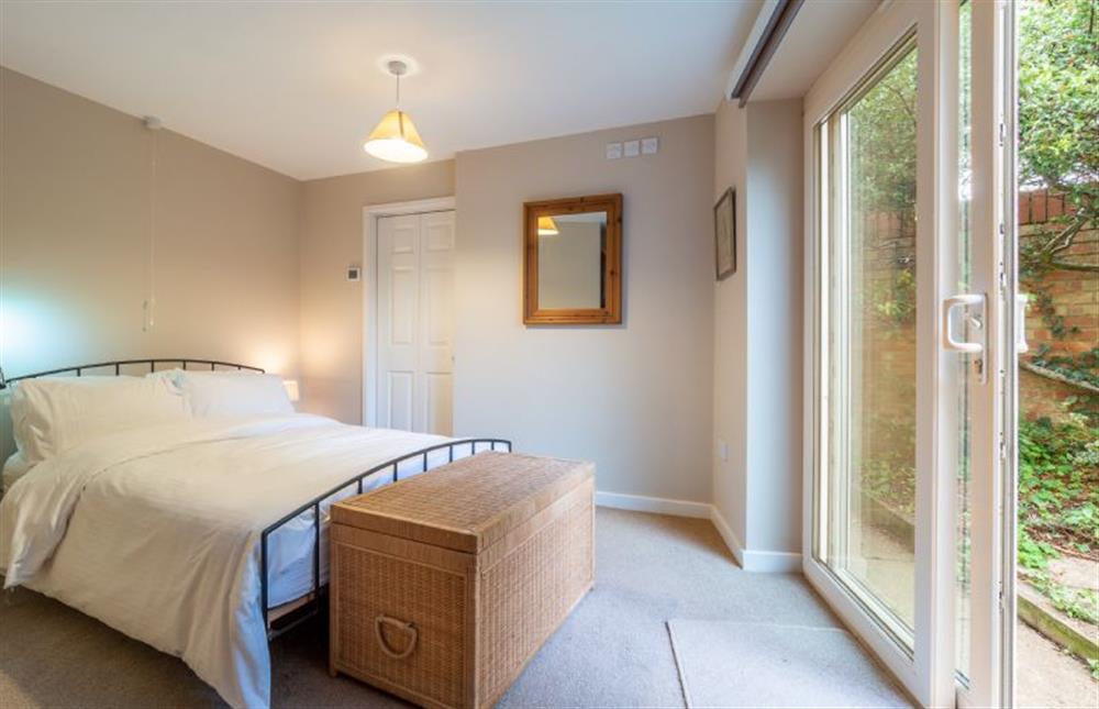 Master bedroom with French doors to the garden at Mariners Way, Aldeburgh