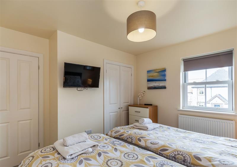 This is a bedroom (photo 3) at Maris Cottage, Filey
