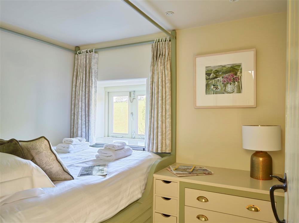 Bedroom one, with a 4’6 double bed, compact room  at Maristow Cottage, Dartmouth 