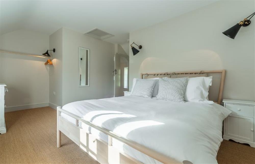 First floor:  Bedroom four with king-size bed  at Market Square House, Fring near Kings Lynn