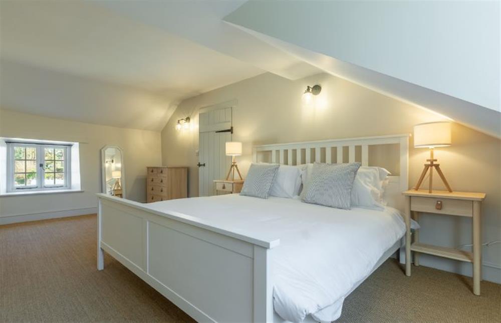 First floor: Bedroom two with king size bed (photo 2) at Market Square House, Fring near Kings Lynn