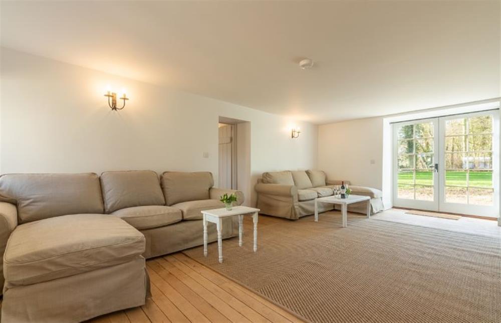 Ground  floor:  Sitting room has two comfortable L shaped sofas, television with Sky and DVD player plus bi-fold doors