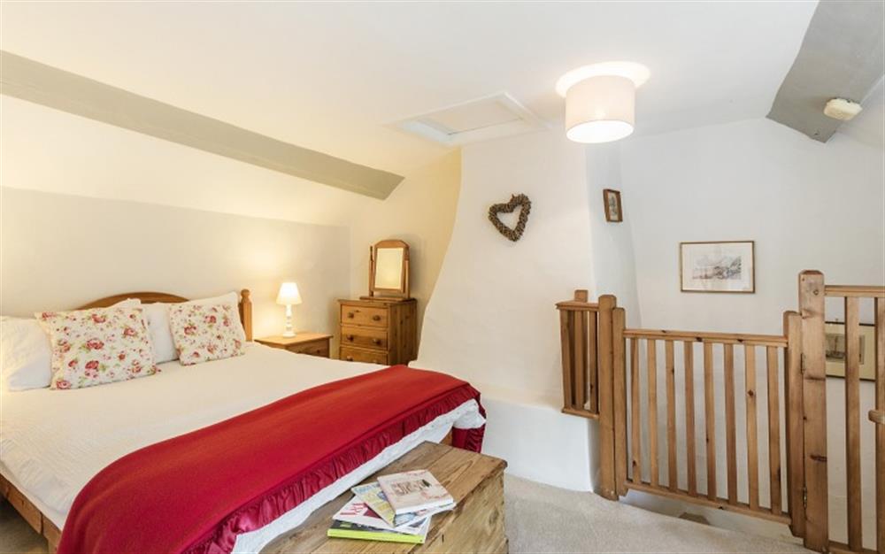 The stairs lead into Bedroom 1 with 4ft 6inch double bed at Marquis of Lorne Cottage in Bridport