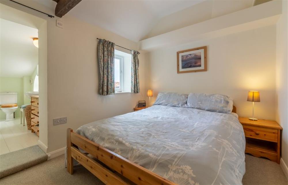 Master bedroom with en-suite bathroom at Marram Cottage, Brancaster Staithe near Kings Lynn