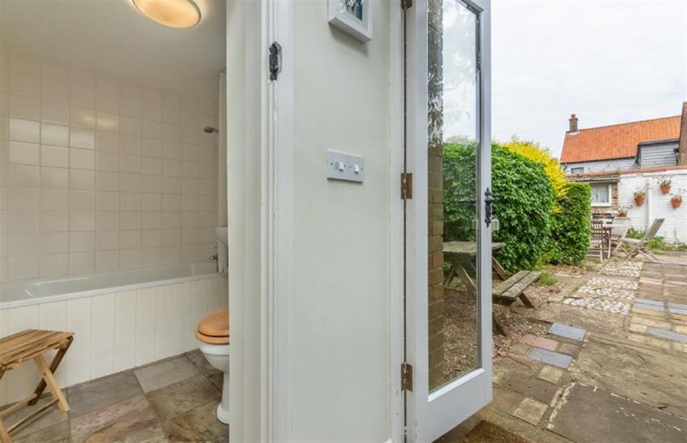 The downstairs bathroom is by the back door into the courtyard garden at Marram Cottage, Brancaster Staithe near Kings Lynn
