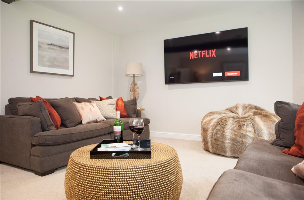 The television room is perfect for those cosy nights in at Marrington Farmhouse, Montgomery