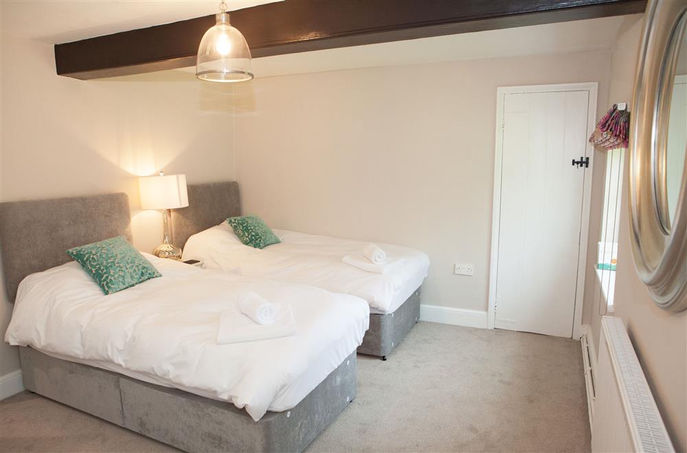 Wagtail bedroom with twin 3’ single beds at Marrington Farmhouse, Montgomery