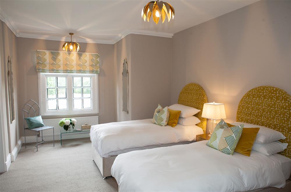 Moss bedroom with twin 3’ single beds and en-suite shower room at Marrington Hall, Montgomery