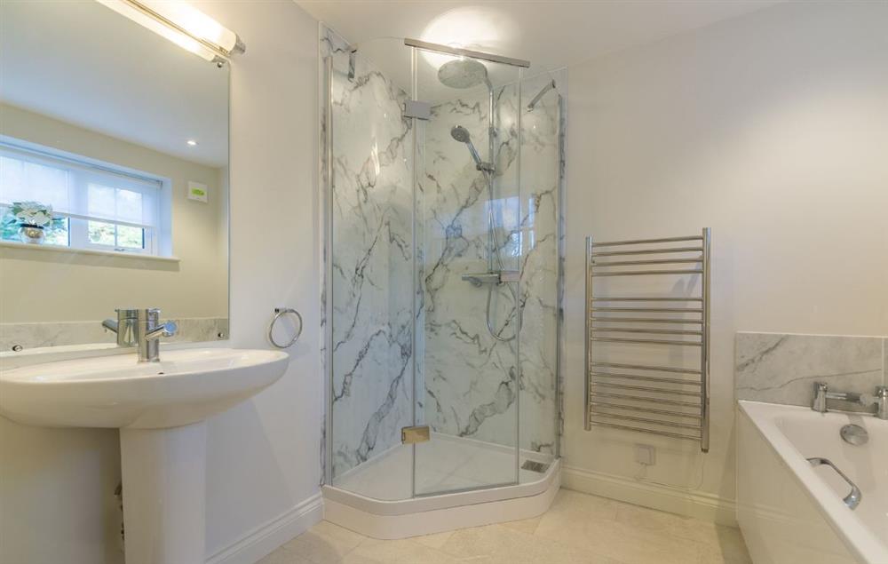 En-suite bathroom with bath and separate walk in shower at Marsh Lodge, Aldeburgh