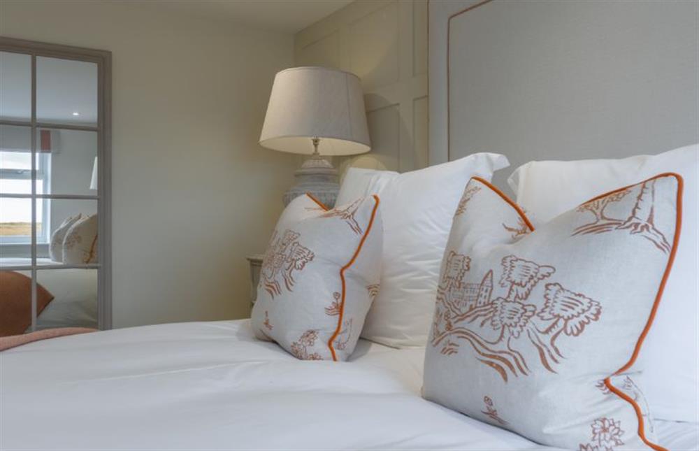 Ground floor:  Enjoy views of the marsh from both sides of the bed at Marsh Retreat, Brancaster near Kings Lynn