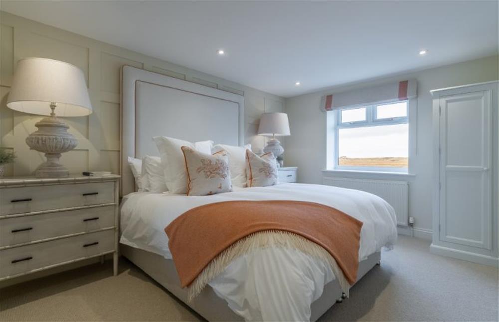 Ground floor: The bedroom boasts a super-king size bed at Marsh Retreat, Brancaster near Kings Lynn