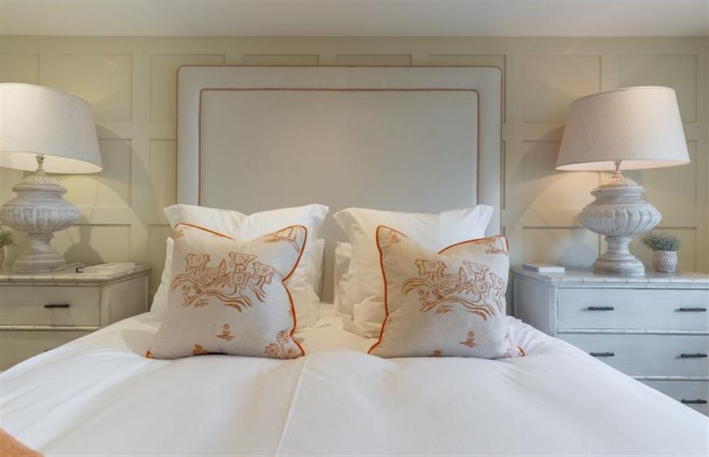 Ground floor: The large bed is dressed in luxury linens at Marsh Retreat, Brancaster near Kings Lynn