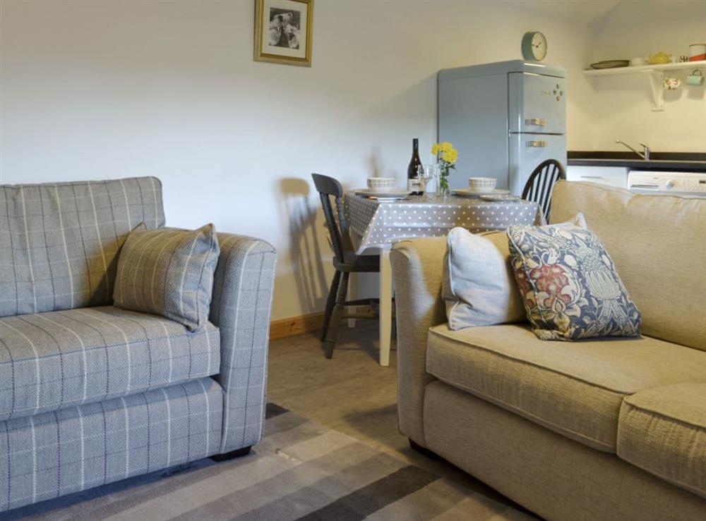 Comfy seating in open-plan living space at Marys Cottage in Clachan, Staffin, Isle Of Skye